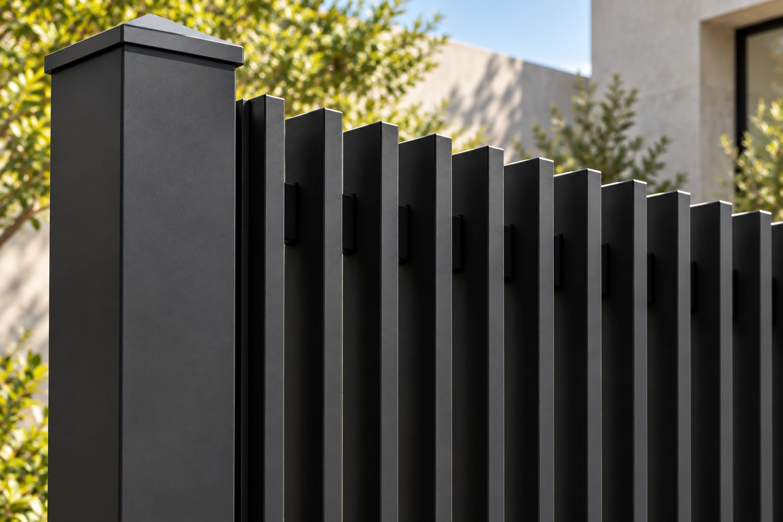 Charcoal narrow deep vertical blade fins beside a capped post