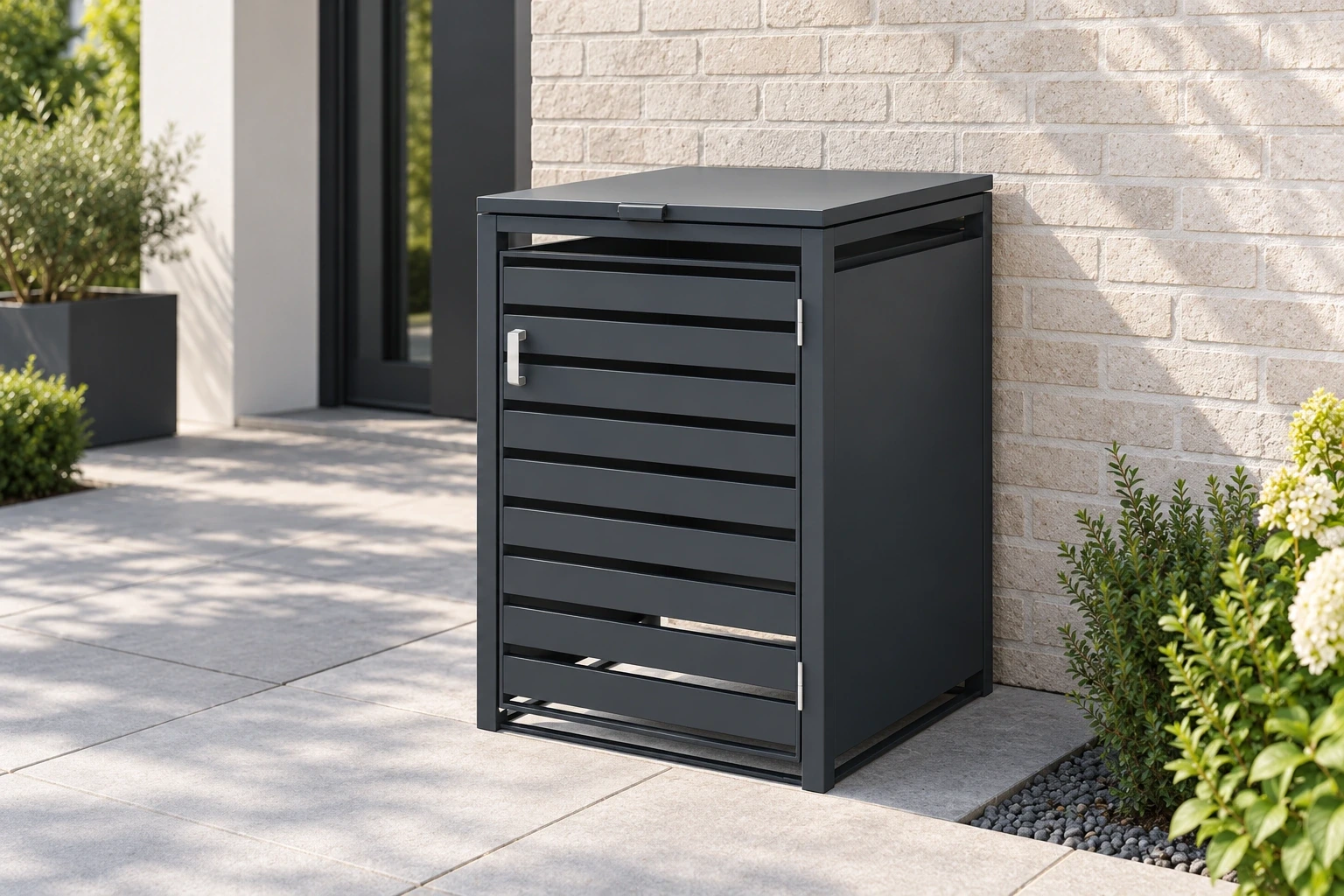 One charcoal louvred bin-storage cabinet on a clear paved path beside a light brick wall