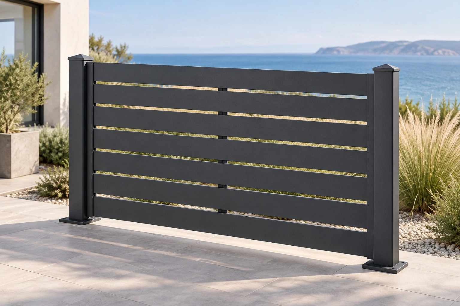 A graphite open-slat fence with square posts on a coastal terrace.