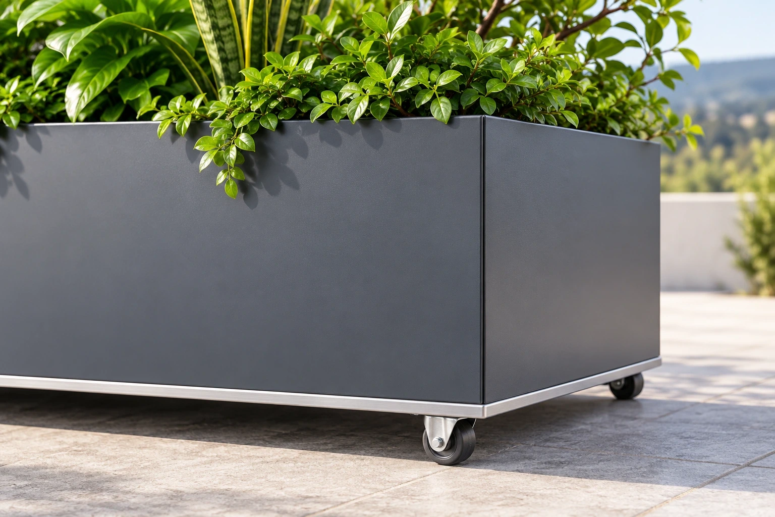 Close view of a smooth charcoal planter corner, thin upper rim and a small caster beneath the base